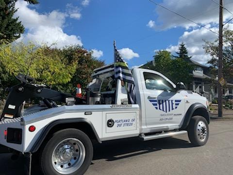 Elite Towing & Recovery truck on a sunny day