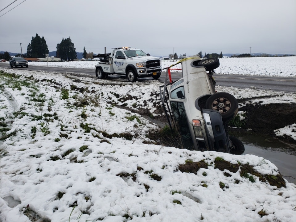 Elite Towing & Recovery truck at a winter recovery scene